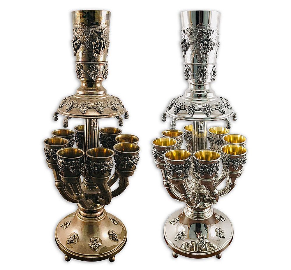Ornate antique sterling silver Judaica wine fountain, restored by Chelsea Plating Company with 24k gold plating inside the cups, demonstrating their expertise in professional cleaning, polishing, and Judaica restoration.