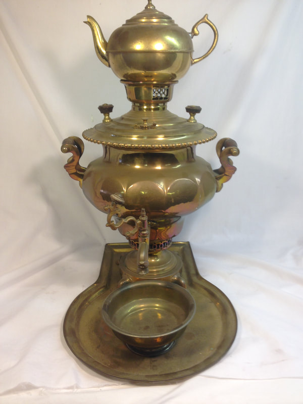 Aged and corroded Russian Samovar pre-restoration, evidence of its storied past.