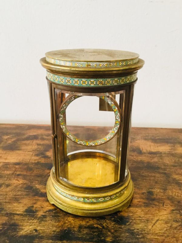 Antique brass and glass case before restoration, showing tarnish and signs of wear.